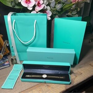 Vintage Tiffany & Co. ladies 14k yellow gold watch with diamonds around bezel.